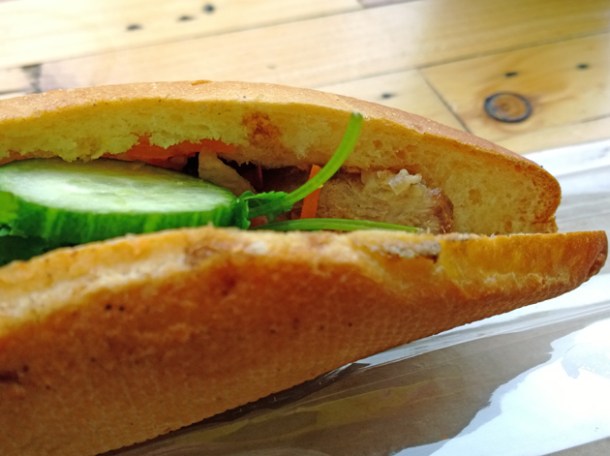 close up of crackling pork belly baguette at banh mi 11 shoreditch