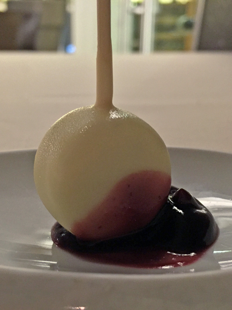 white chocolate gorgonzola lollipop with porto sauce at metamorfosi