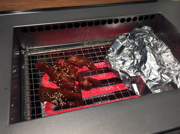 skirt steak and mushroom medley on the grill at kintan