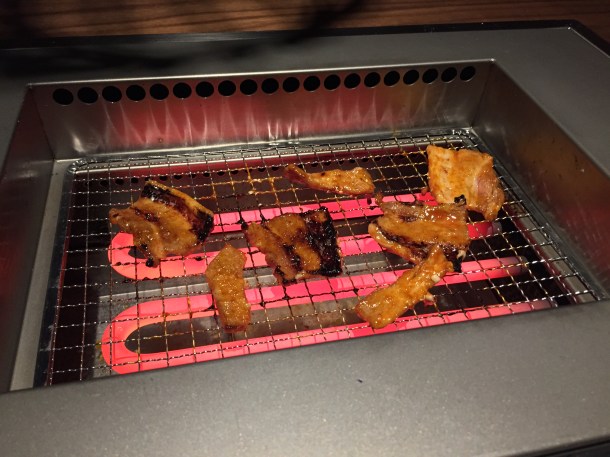 spicy pork kalbi on the grill at kintan