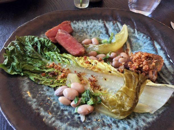 iberico presa with pig's head terrine, beans, anchovy and lettuce at paradise garage