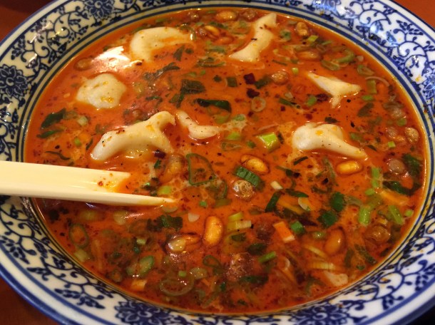 pork and vegetable dumplings in chilli soup at master wei