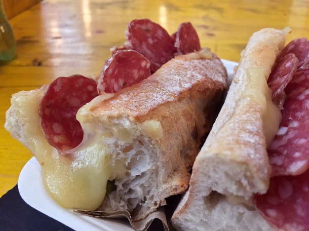 illustrative photo of the Raclette sandwich with extra saucisson from Champangne Fromage at Mercato Metropolitano.