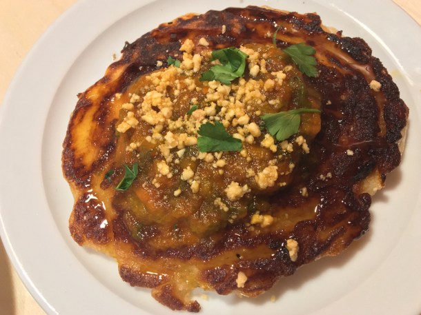 illustrative photo of the rice pancakes with pumpkin and peanut sauce at Chuku's