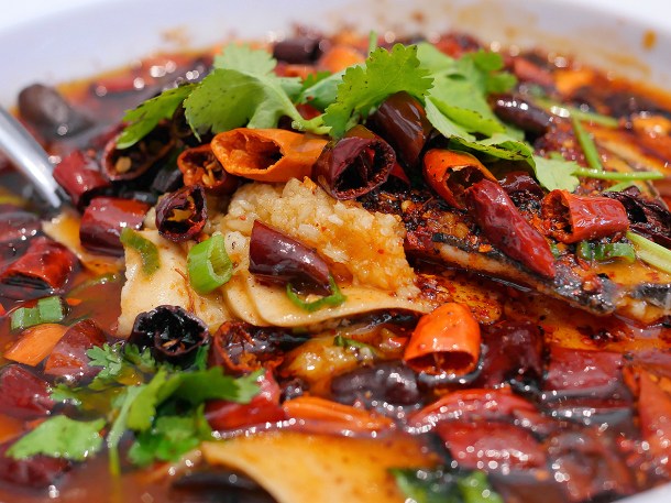 illustrative photo of the sliced fish in sizzling chilli oil at Tofu Vegan