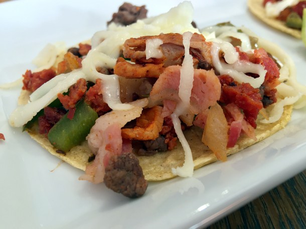 illustrative photo of the queso alhambre tacos at La Chingada