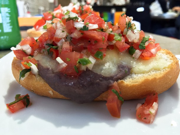 illustrative photo of the tomato, cheese, chilli and beans on bread at La Chingada