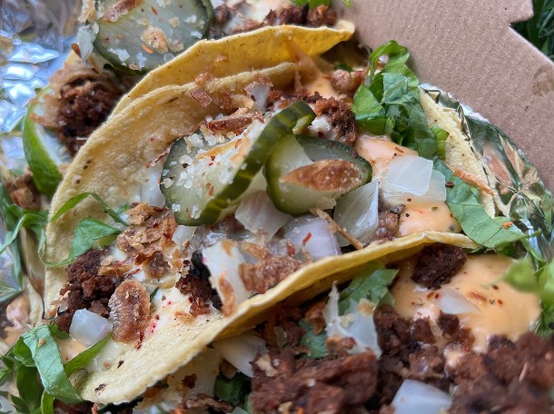 illustrative photo of the cheezeburger vegan tacos from Club Mexicana