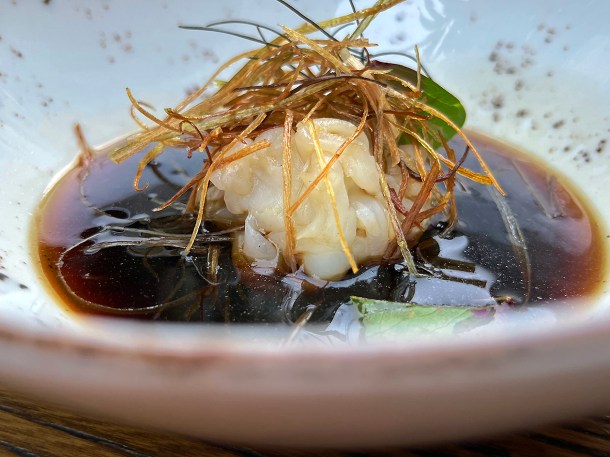 illustrative photo of the smoked ham hock consomme with squid at Sarap Bistro Mayfair
