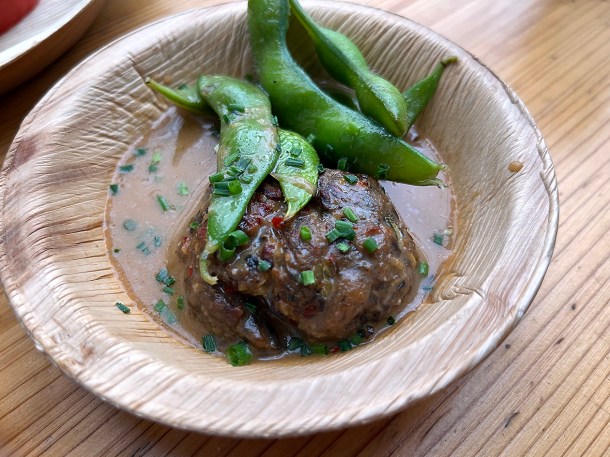 illustrative photo of the spring onion and ginger dumpling in ramen broth at Acme Fire Cult