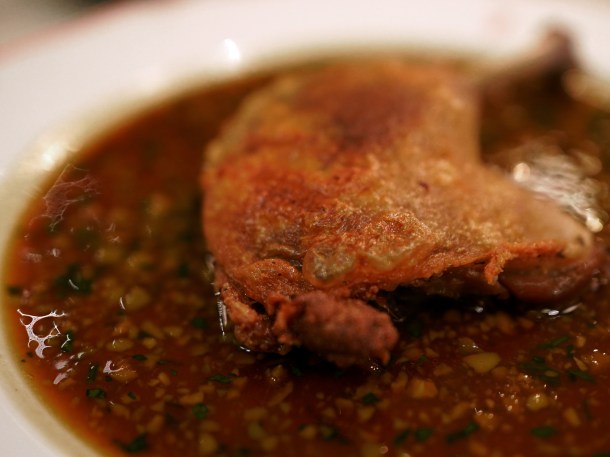 illustrative photo of the confit duck leg with olive sauce at Josephine Bouchon